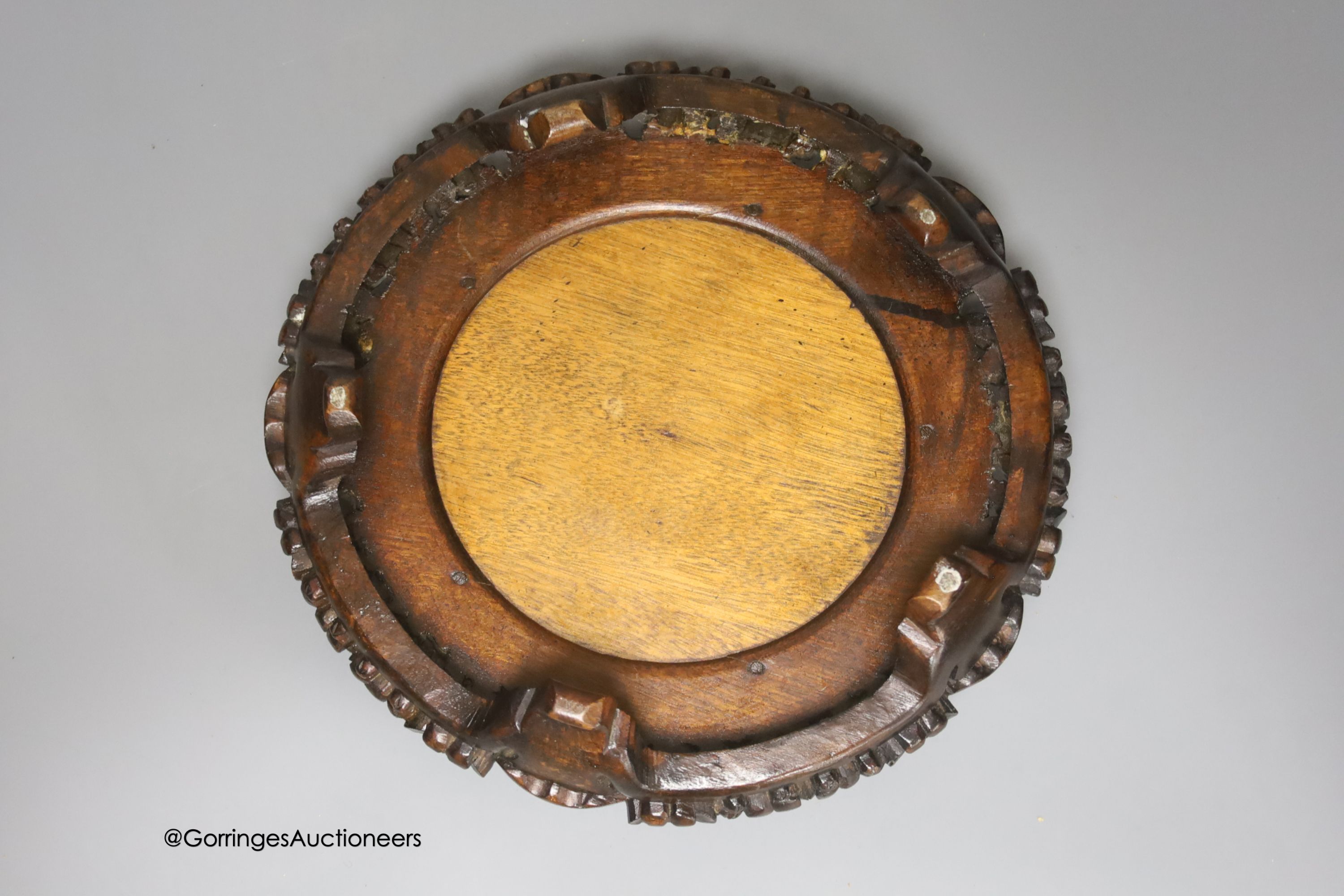 A Japanese carved and pierced hardwood stand, diameter 22cm
